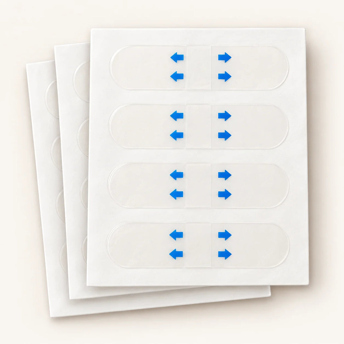 Clear face-lifting strips on staggered white backing sheets with blue-arrow protective liners.